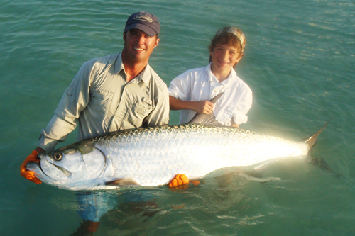 Capt. Stacy and Mike Vennetti releasing a Longboat Key Tarpon 6/2008'