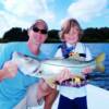 Five year old Marcas Reynolds with Dad and his biggest Snook of the day 9/2009'